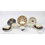 An 18th century Caughley tea bowl, decorated in blue and white depicting fruit sprigs, 7.