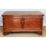 A Continental pitch pine coffer of large proportions, with shaped panelled front,