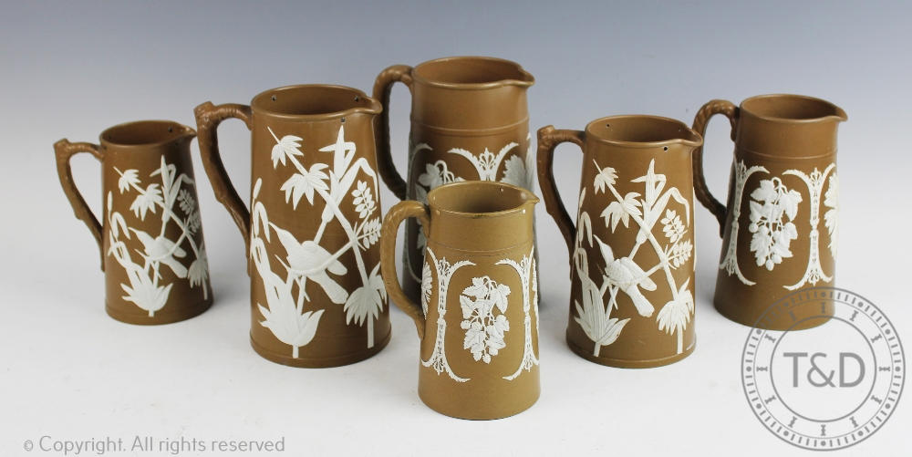 A set of three Victorian Dudson Pottery Aesthetic jugs,