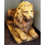 A pair of reconstituted stone garden lions,
