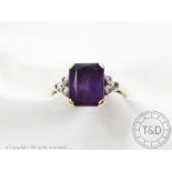 An amethyst and diamond ring, designed as a central rectangular,