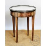 A French Louis XVI style walnut circular occasional table, with marble top,
