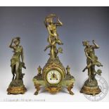 A late 19th century bronzed spelter and onyx clock garniture,