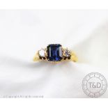 An untested sapphire and diamond three stone ring,