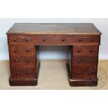 A Victorian oak pedestal desk, with an arrangement of nine drawers, on plinth base,