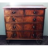 An early 19th century mahogany chest, of two short and three long drawers, on turned feet,