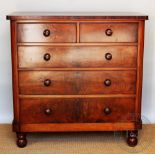 A Victorian mahogany chest, of two short and three graduated long drawers, on turned feet,