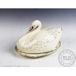 A late 19th century Staffordshire cheese bell and cover modelled as a swan on a base,