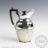 A Victorian silver hot water pot, Walter & John Barnard, London 1881,