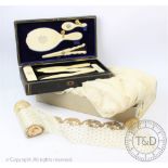 A Victorian leather cased ivory dressing table set,