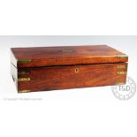 An early 19th century brass bound walnut writing slope, with recessed brass handles and base drawer,