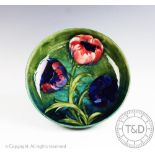 A large Moorcroft bowl, decorated in a poppy pattern,