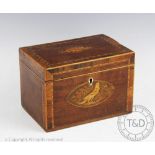 An early 19th century inlaid mahogany tea caddy, decorated with a shell and a bird,