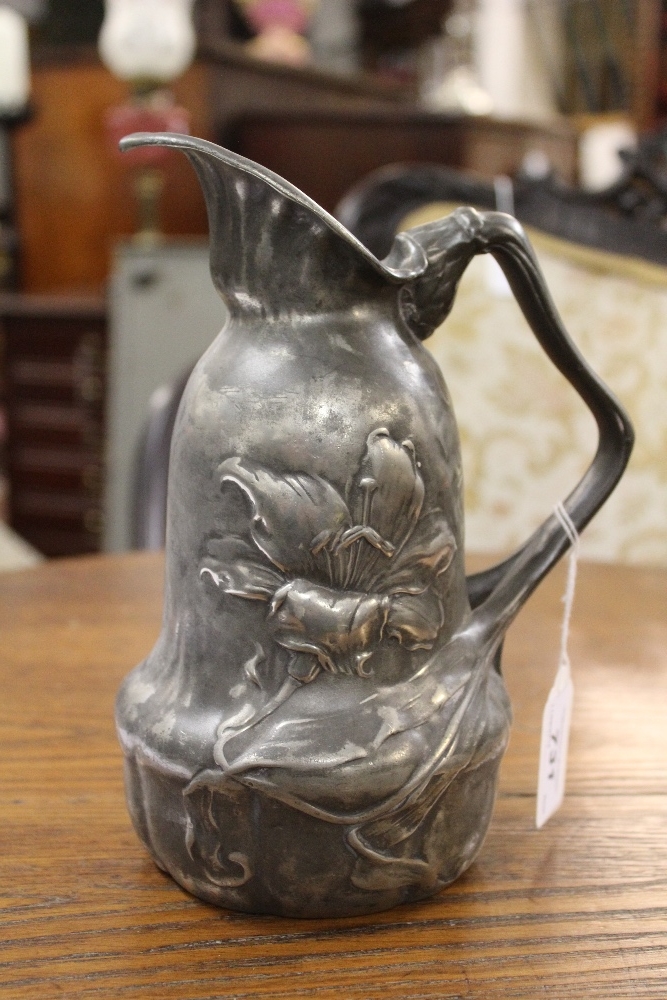 An Art Nouveau pewter ewer, of shaped form and cast with flowers, - Image 4 of 6