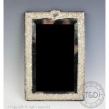 A silver framed mirror, Carr's of Sheffield Ltd, Sheffield 1992,