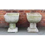 Two composition garden planters, of square form, decorated with stylized roses, on square bases,