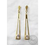 A pair of gem set 9ct gold drop earrings, each designed as a tapering,