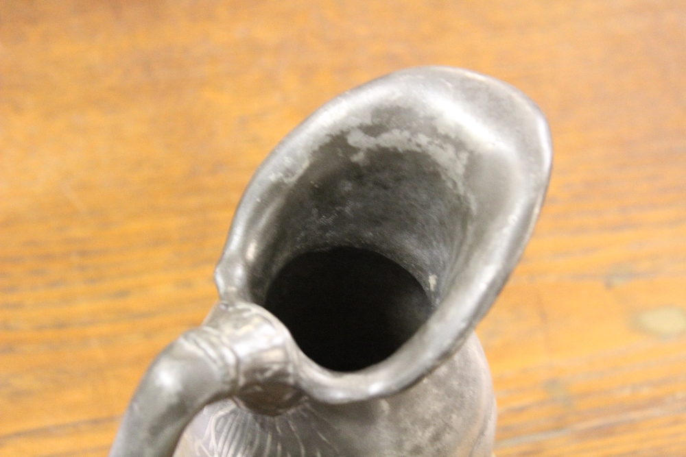 An Art Nouveau pewter ewer, of shaped form and cast with flowers, - Image 6 of 6