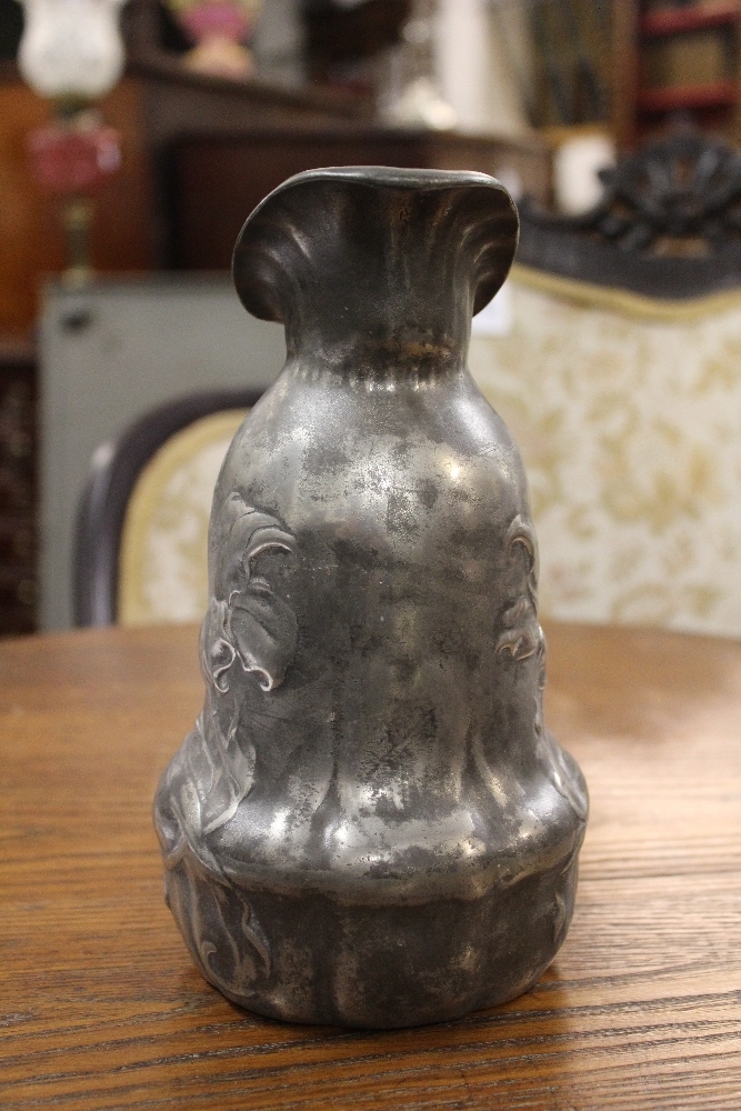 An Art Nouveau pewter ewer, of shaped form and cast with flowers, - Image 3 of 6