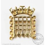 A yellow metal brooch in the form of a Houses of Parliament portcullis brooch, unmarked, weight 5.