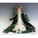 An Armand Marseille bisque headed doll, with sleeping eyes and jointed cloth body,