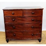 An early 19th century mahogany bow front chest, of four graduated long drawers, on turned feet,