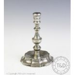 An 18th century pewter candlestick dated 1781,