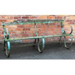 A Victorian wrought iron garden bench, with scroll supports,