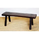A late 19th / early 20th century stained elm and pine pig type bench, on rectangular legs, 48.