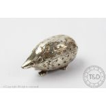 An early 20th century novelty silver pin cushion modelled as a hedgehog, 5cm long,