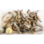 A selection of vintage brass and metal blow torches, with a copper and brass horn,