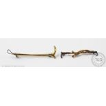A 9ct gold Deakin and Francis bar brooch, designed as a riding crop, and another similar,