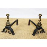 A pair of late 17th century English wrought iron andirons / fire dogs,