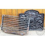 A cast iron fire back, and irons and grate,