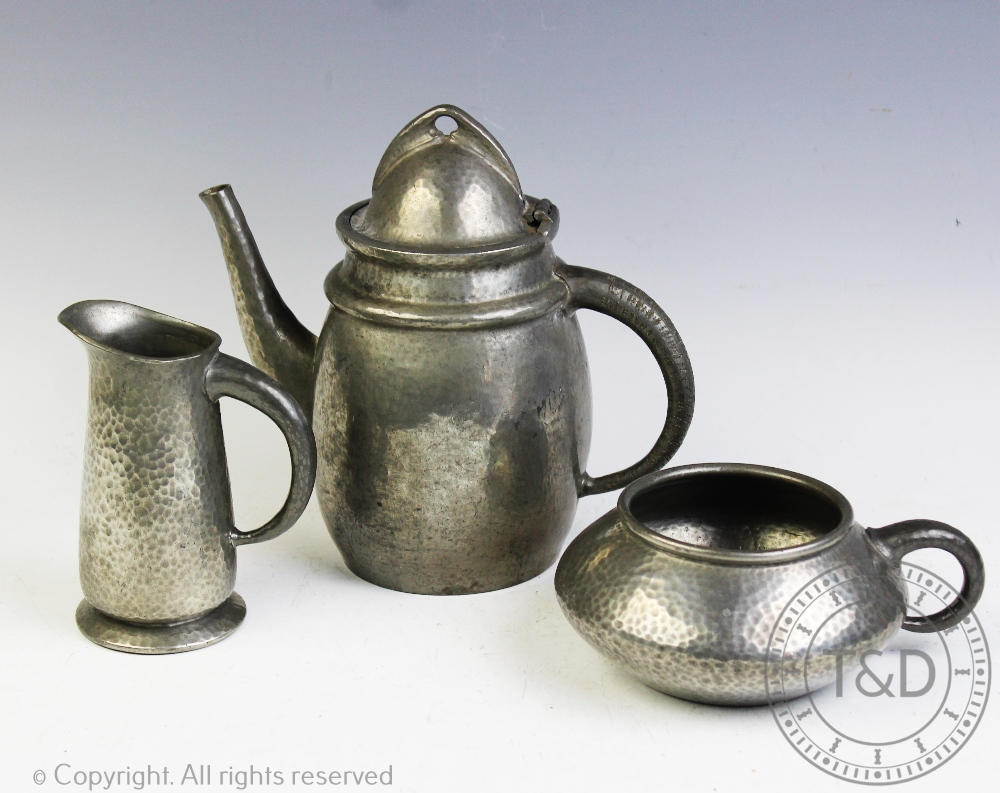 An Art Nouveau Tudric pewter three piece coffee set,