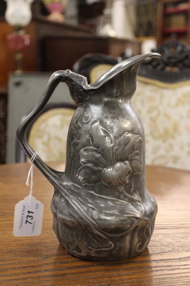 An Art Nouveau pewter ewer, of shaped form and cast with flowers, - Image 2 of 6