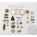 A collection of gold coloured jewellery, to include; hinged bangles, brooches, earrings,