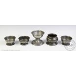 A pair of 19th century pewter salts, makers initials 'SD', with a smaller salt,