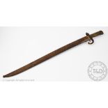 A French 'St Etienne' bayonet and scabbard, the blade back inscribed and dated 1869,