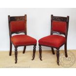 A set of four late 19th century Aesthetic chairs, the cresting rails carved with a sunflower,