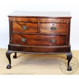 A 1920's mahogany bow front chest, with two short and one long drawer,