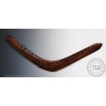 An Australian Aboriginal carved Queensland Boomerang, with carved detailing,