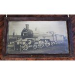 A large framed black and white print of a Great Northern Railway steam engine 990,