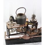 A 19th century steel and iron footman, 30cm H, with a steel and iron warming plate footman,