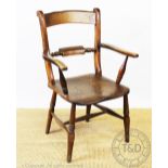 A 19th century oak and ash country kitchen carver chair, with solid seat and turned legs,
