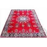 A large Persian Mashad wool carpet, of unique floral medallion design,
