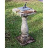 A reconstituted stone garden sundial, the bronze dial engraved '1996 Canfield Latitude 52 56N',