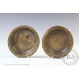 A near pair of late 18th/ early 19th century vernacular turned wood platters, 18cm diameter,
