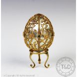 A Franklin Mint 'The Emergence of Spring' silver gilt egg in the manner of Faberge, London 1978, No.