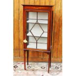 An Edwardian painted mahogany display cabinet, with astragal glazed door, on tapered legs,
